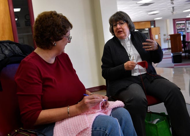 Jean Marsha (left) and Marty CashBurless talk as they work Jan. 24 with the In the Loop needle arts group at McMurry University.